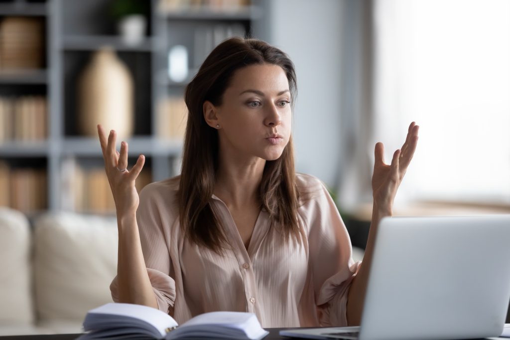 Stressed woman at laptop image