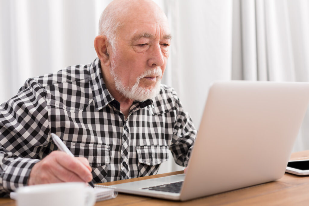 Older man using laptop